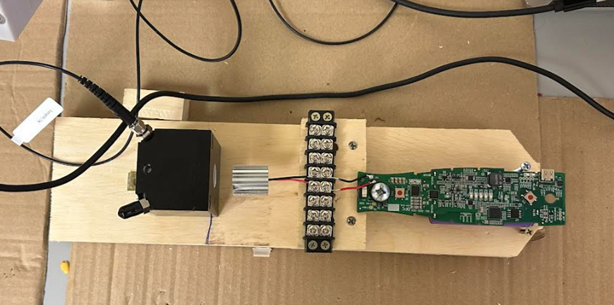 Early bench LIV proof of concept: detector head on plywood; heatsink and drive PCB are lightly softened for confidentiality